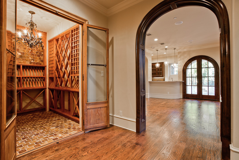 Design ideas for a mid-sized traditional wine cellar in Dallas with slate floors, diamond bins and multi-coloured floor.