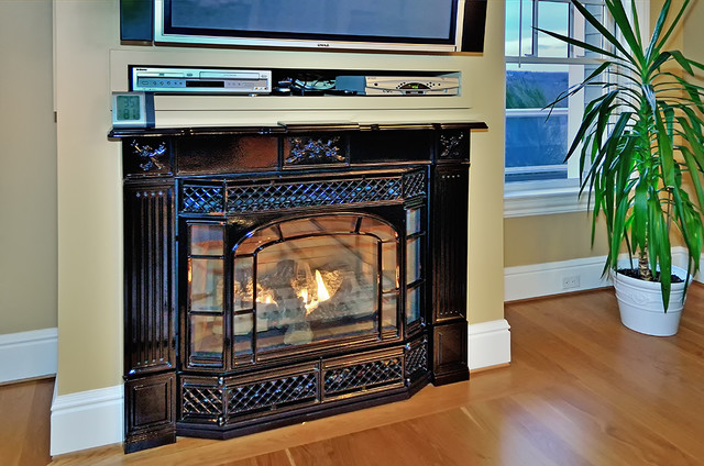 This fireplace is the perfect blend of elegance and high tech heating performance. Custom home built by Mystic River Building Company. Mystic
