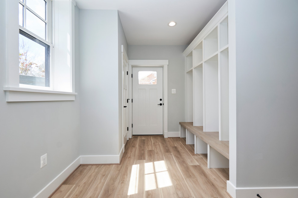 Large transitional vinyl floor and gray floor mudroom photo in DC Metro with gray walls