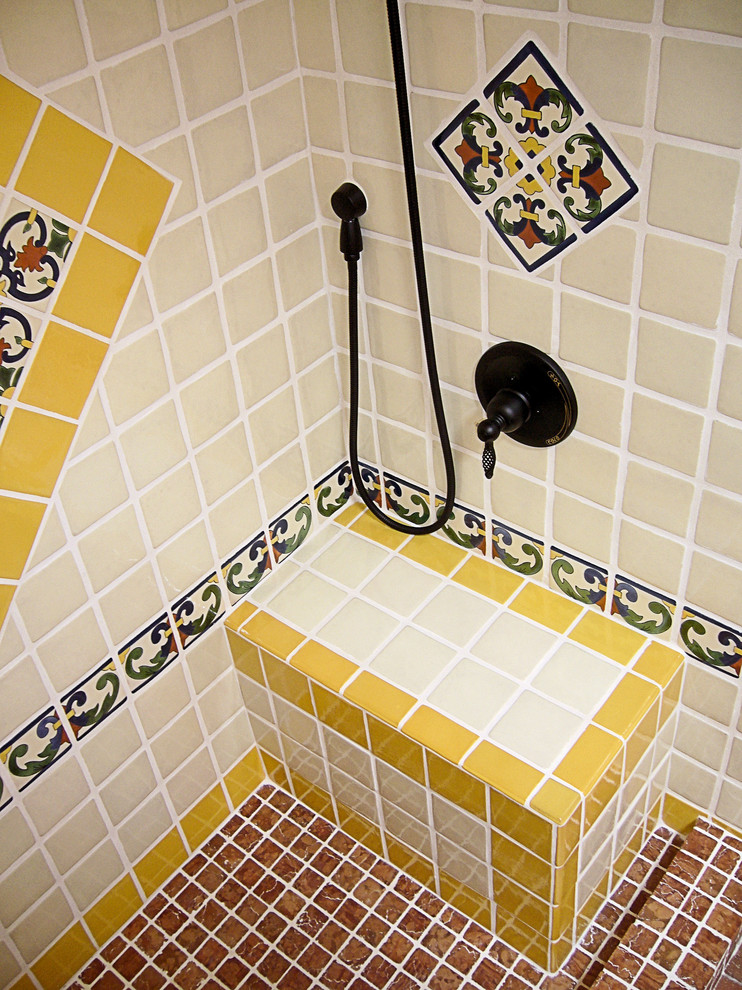 Design ideas for a mid-sized 3/4 bathroom in Portland with raised-panel cabinets, light wood cabinets, an alcove shower, a one-piece toilet, blue tile, white tile, yellow tile, ceramic tile, white walls, brick floors, an integrated sink, tile benchtops, red floor and a shower curtain.