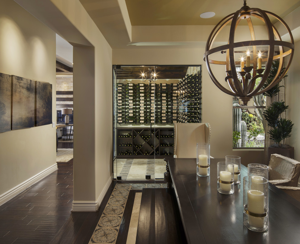 Photo of a mid-sized transitional wine cellar in Phoenix with porcelain floors, storage racks and brown floor.