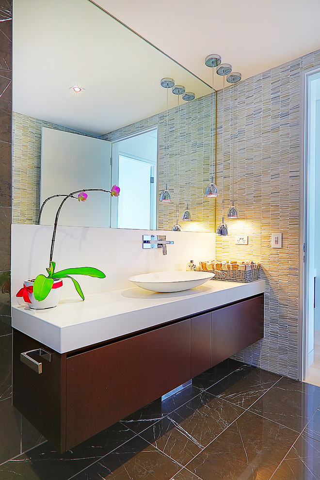 This is an example of a contemporary powder room in Sydney with mosaic tile and a vessel sink.