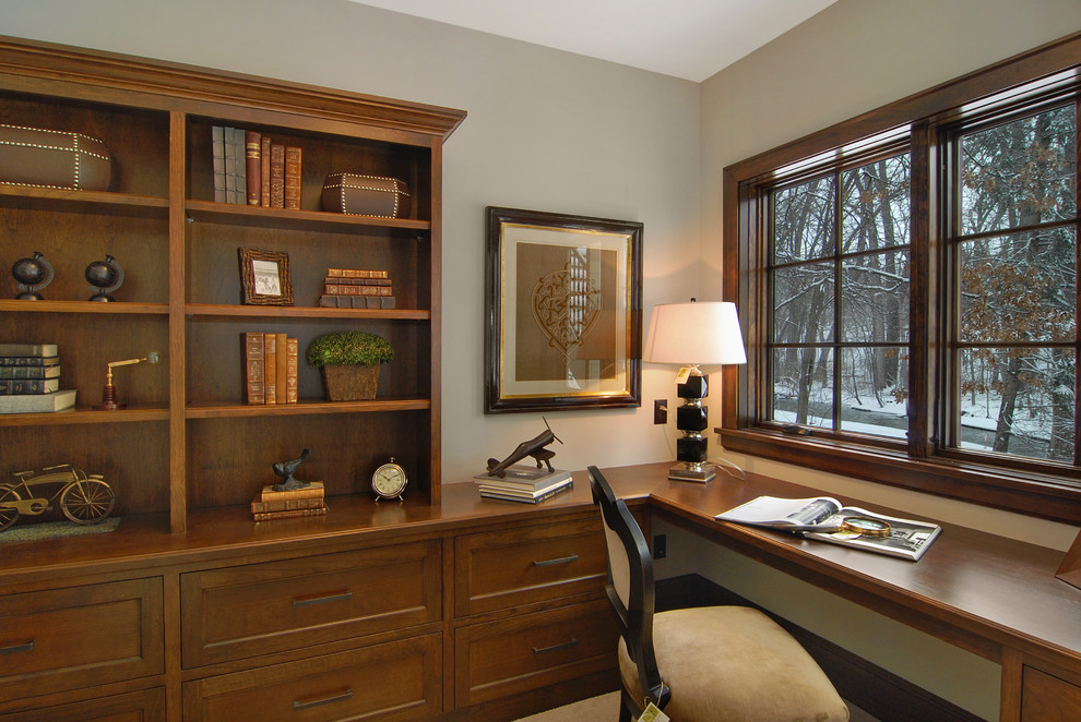 Photo of a traditional home office in Minneapolis with grey walls and a built-in desk.