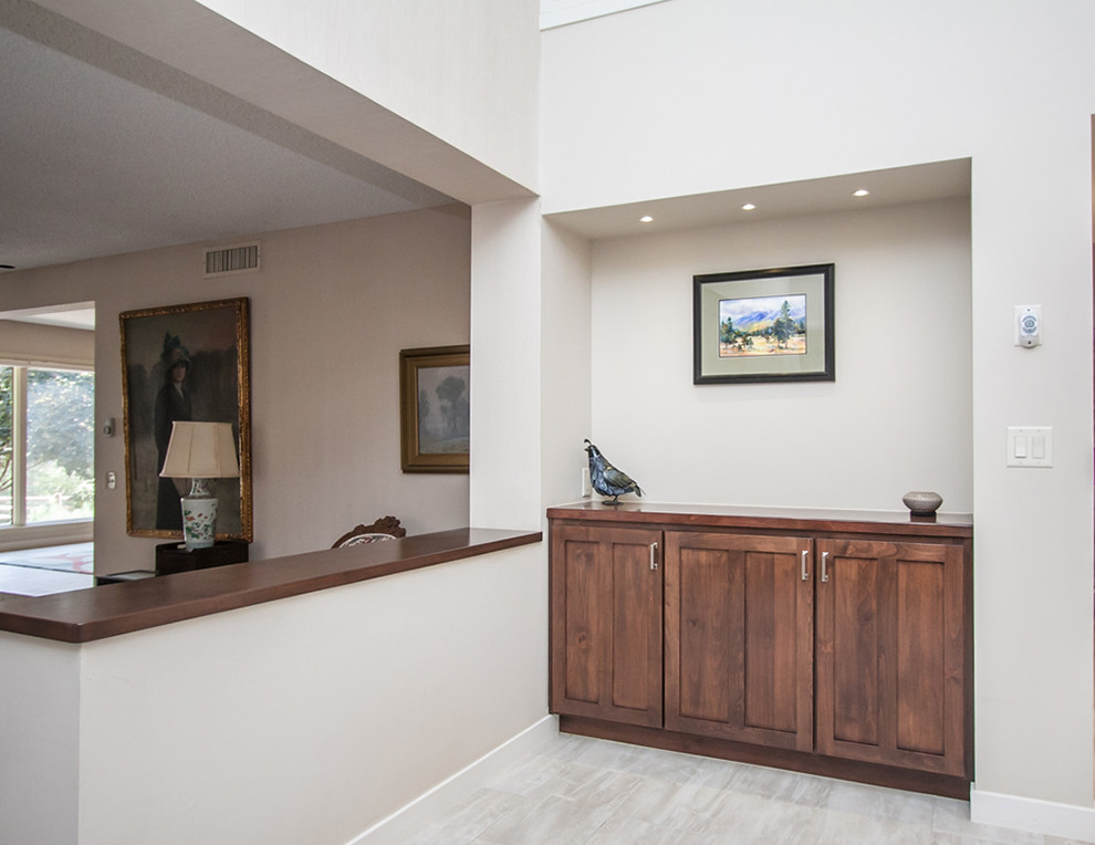 Mid-sized transitional porcelain tile and gray floor hallway photo in Phoenix with gray walls