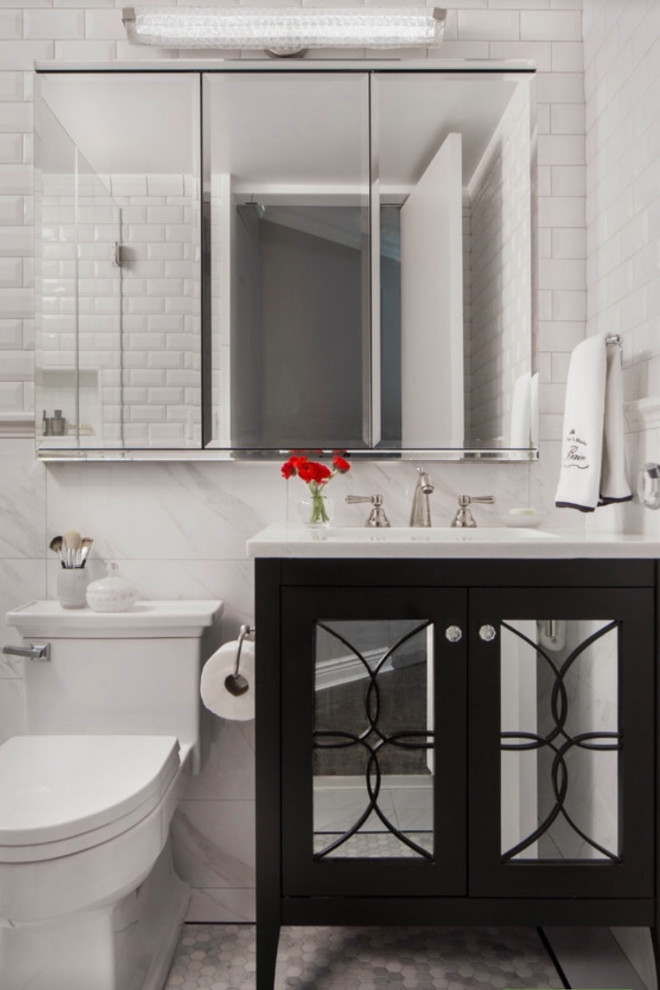 This is an example of a large transitional bathroom in Atlanta with black cabinets, marble benchtops, white benchtops, a single vanity and a freestanding vanity.