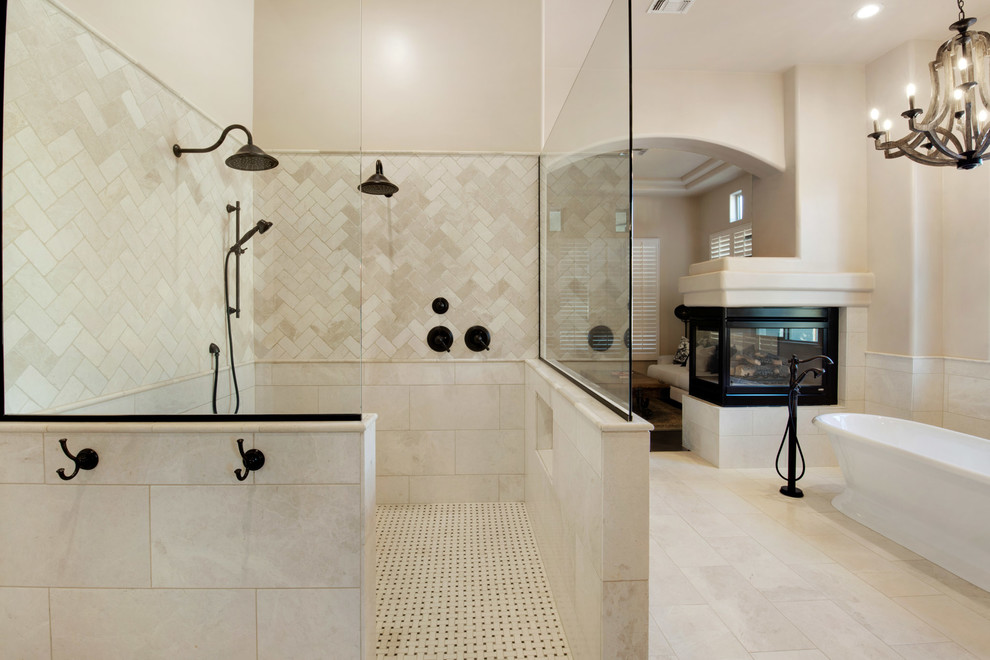 Photo of a large transitional master bathroom in Phoenix with raised-panel cabinets, medium wood cabinets, a freestanding tub, a double shower, a one-piece toilet, beige tile, ceramic tile, beige walls, ceramic floors, an undermount sink, quartzite benchtops, beige floor and an open shower.