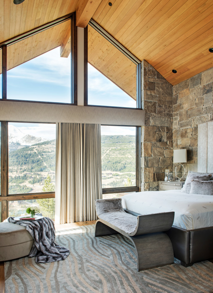 Mountain style master vaulted ceiling and wood ceiling bedroom photo