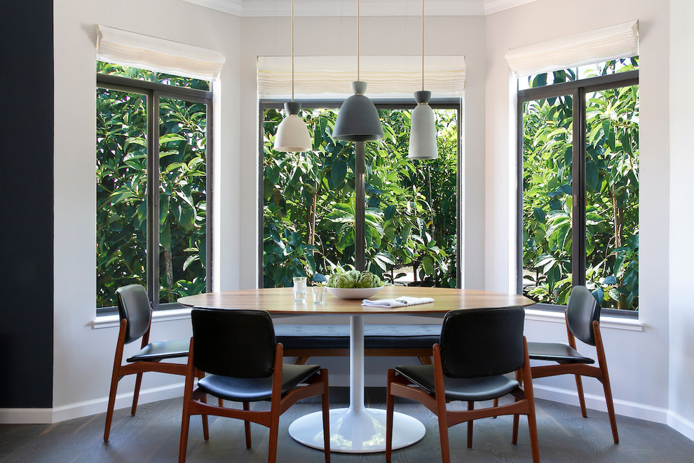 Example of a small 1960s dark wood floor and brown floor great room design in San Francisco with gray walls and no fireplace