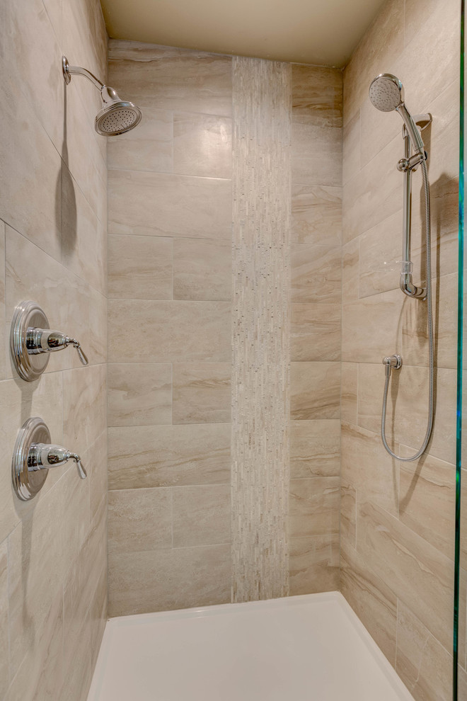 Design ideas for a mid-sized contemporary master bathroom in Seattle with recessed-panel cabinets, medium wood cabinets, a freestanding tub, an open shower, beige tile, travertine, beige walls, porcelain floors, granite benchtops, brown floor, an open shower and a vessel sink.