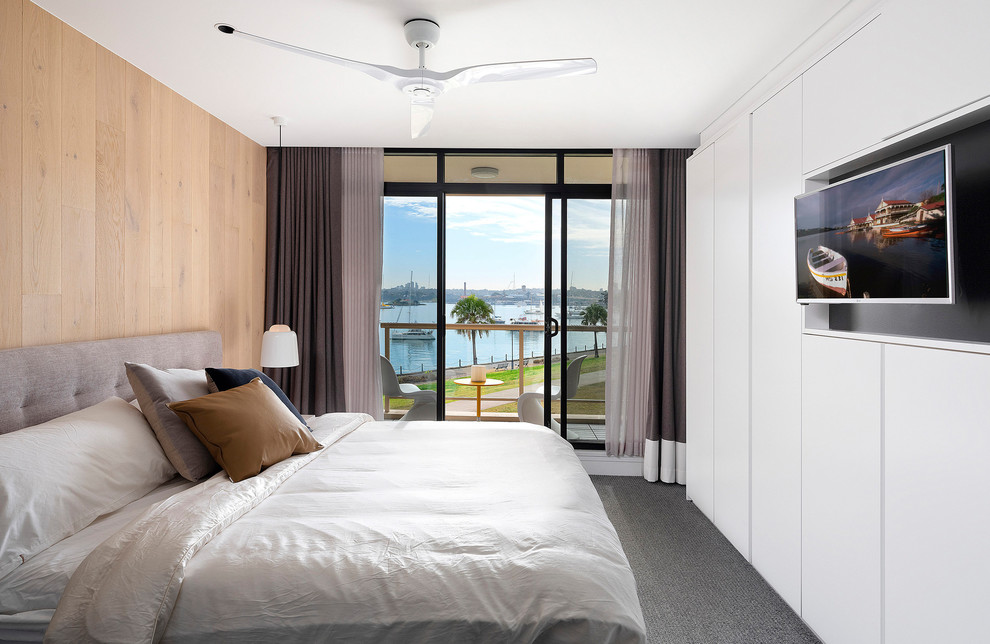 Design ideas for a small contemporary guest bedroom in Sydney with white walls, carpet and grey floor.