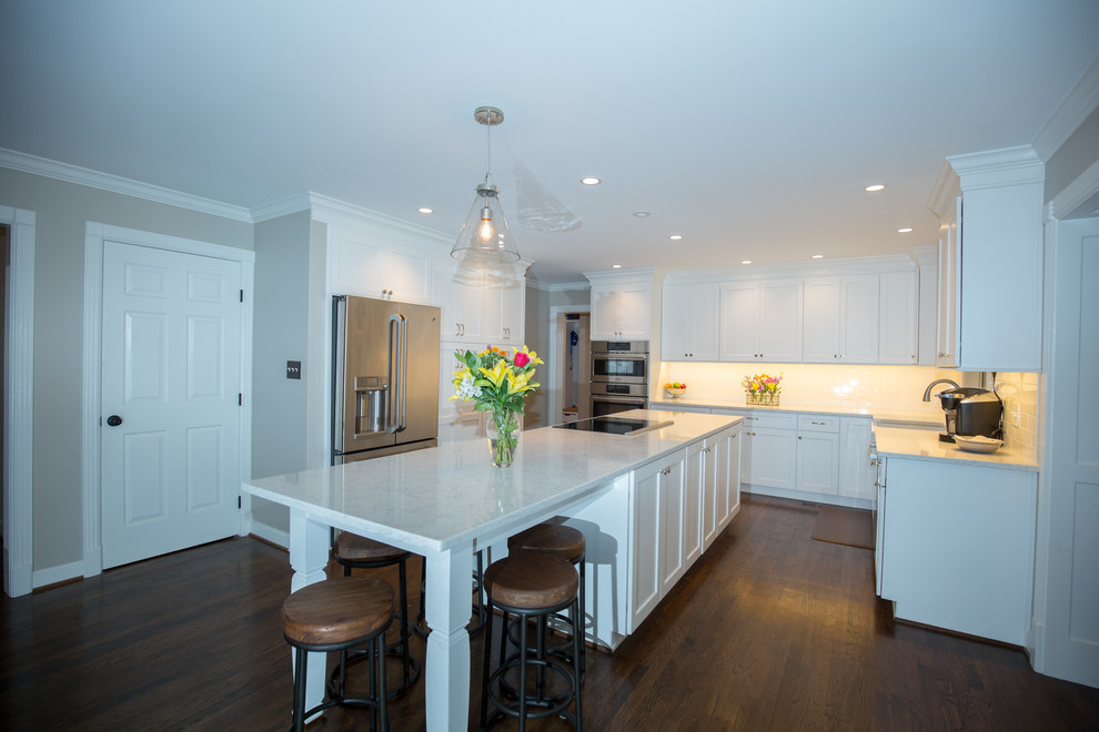 Example of a large transitional medium tone wood floor kitchen design with a farmhouse sink and stainless steel appliances