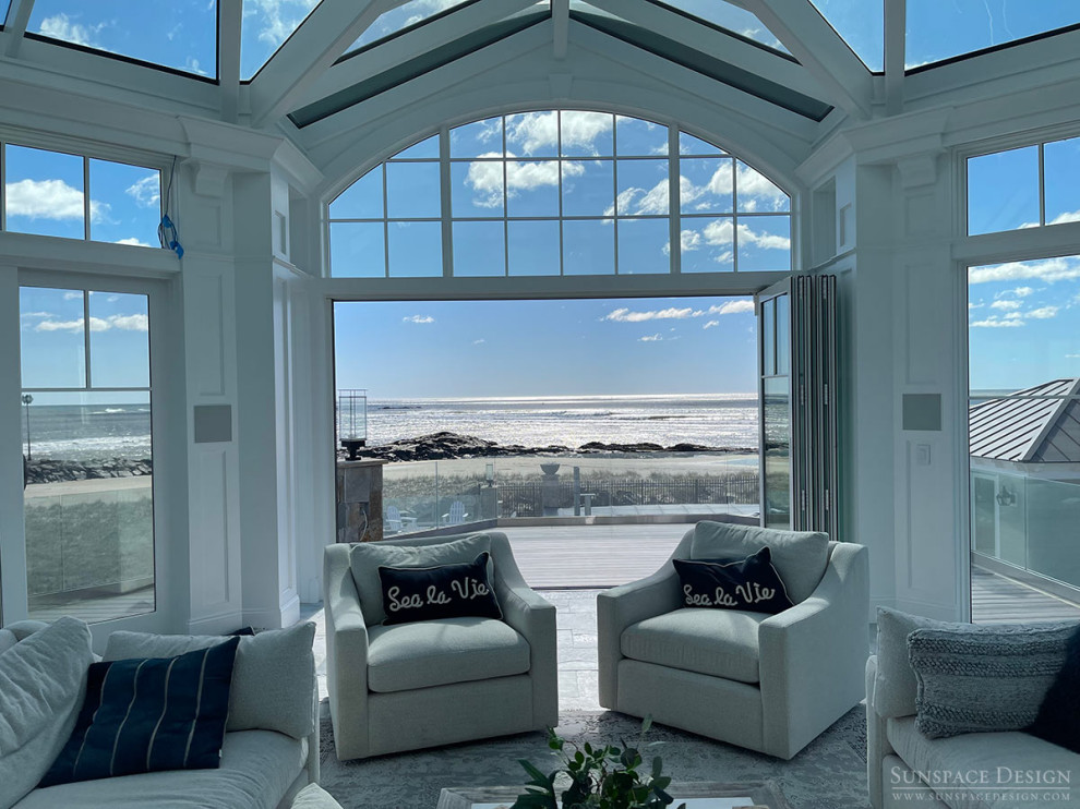 Design ideas for an expansive traditional sunroom with slate floors, a standard fireplace, a stone fireplace surround, a glass ceiling and grey floor.