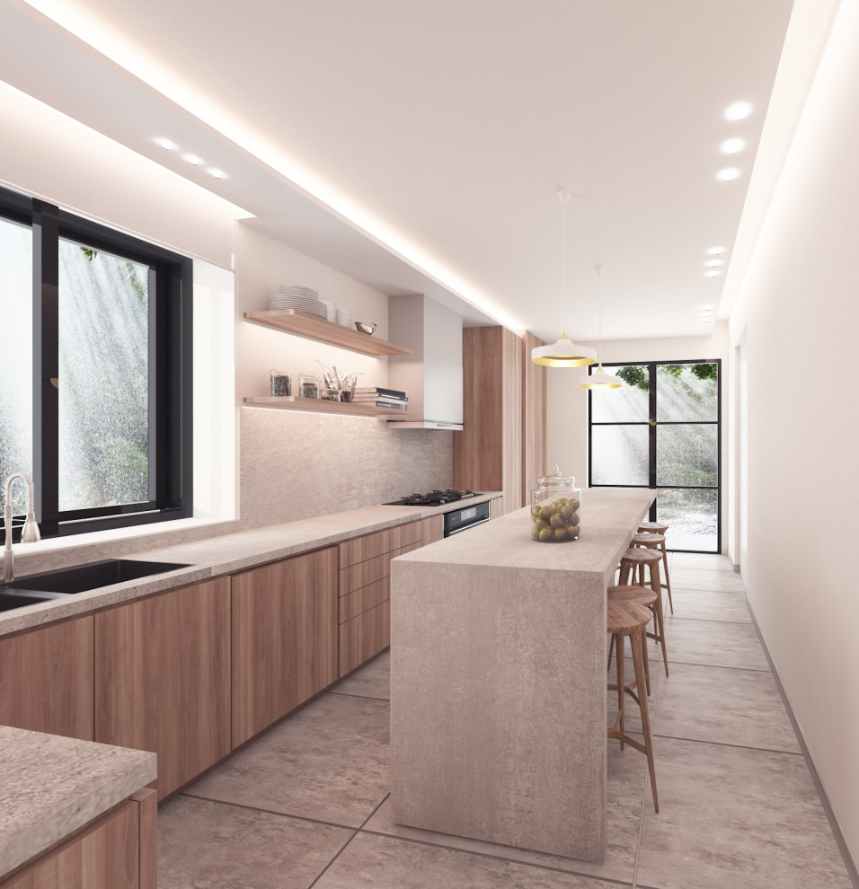 This is an example of a small modern eat-in kitchen in Los Angeles with flat-panel cabinets, light wood cabinets, concrete benchtops, beige splashback, limestone splashback, panelled appliances, cement tiles, with island, grey floor and beige benchtop.