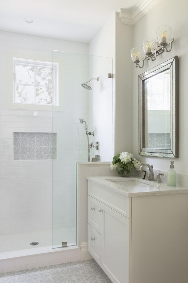 Design ideas for a mid-sized traditional 3/4 bathroom in Boston with raised-panel cabinets, white cabinets, an open shower, white walls, cement tiles, an undermount sink, engineered quartz benchtops, multi-coloured floor, an open shower and white benchtops.