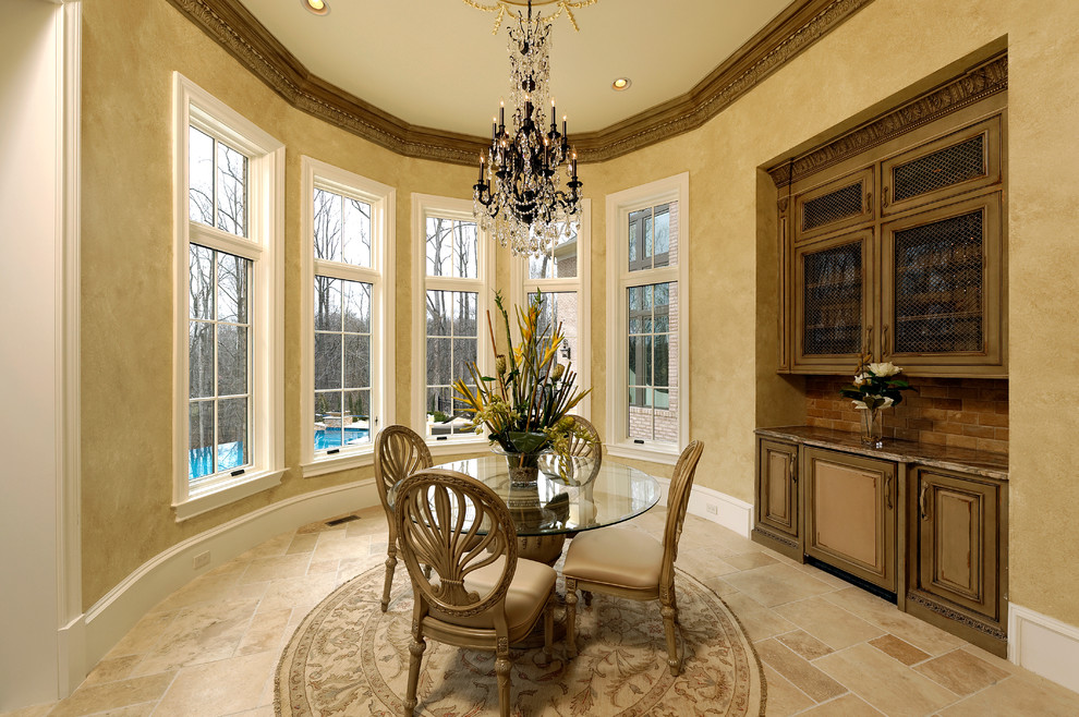 Design ideas for a large traditional kitchen/dining combo in DC Metro with limestone floors.
