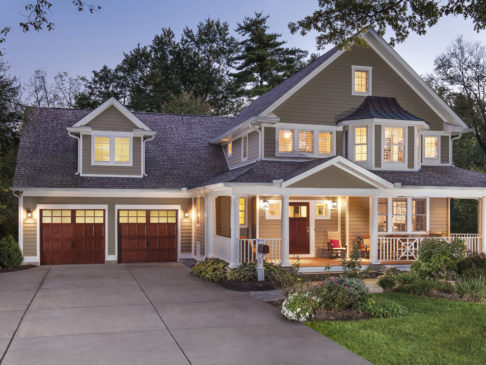 Example of a mid-sized arts and crafts attached two-car garage design in Cincinnati