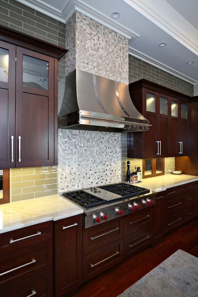 Example of a transitional u-shaped dark wood floor open concept kitchen design in Louisville with an undermount sink, shaker cabinets, dark wood cabinets, granite countertops, glass tile backsplash, stainless steel appliances and an island