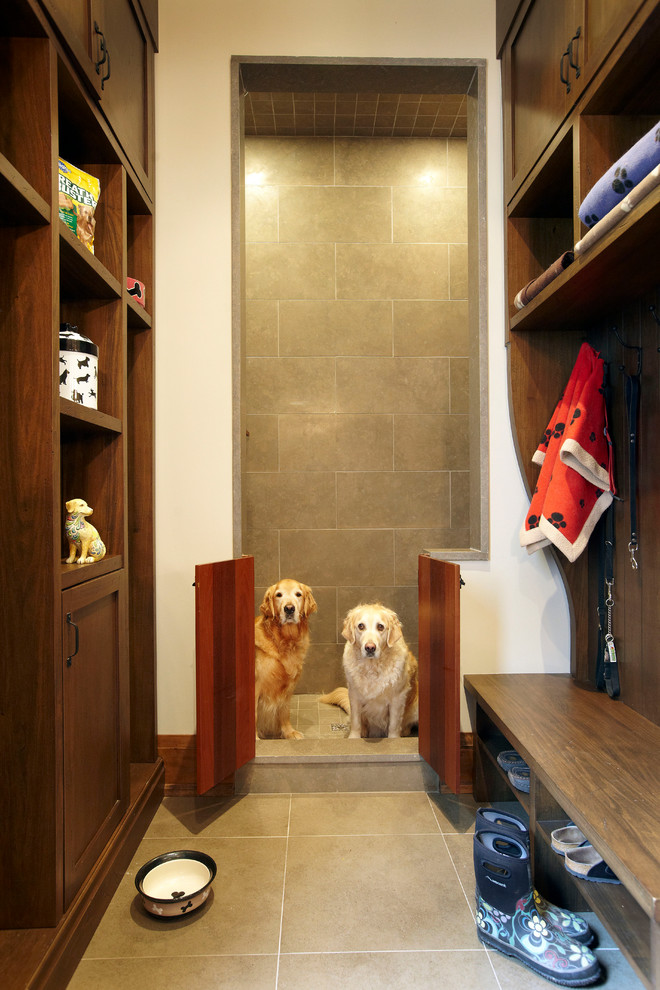 Design ideas for a country mudroom in Toronto with porcelain floors.