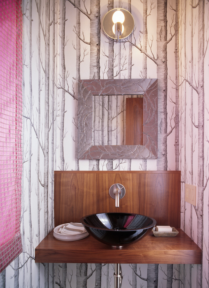 This is an example of a contemporary powder room in San Francisco with a vessel sink and multi-coloured walls.