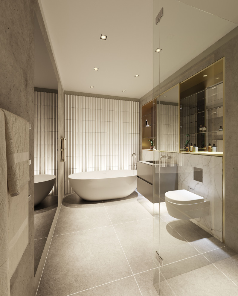 Inspiration for a mid-sized modern master bathroom in London with flat-panel cabinets, grey cabinets, a freestanding tub, a corner shower, a wall-mount toilet, gray tile, porcelain tile, grey walls, porcelain floors, an integrated sink, glass benchtops, grey floor, a hinged shower door, grey benchtops, a niche, a single vanity and a floating vanity.