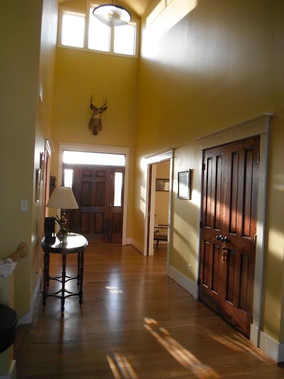 Example of a mountain style medium tone wood floor home design design in DC Metro with yellow walls