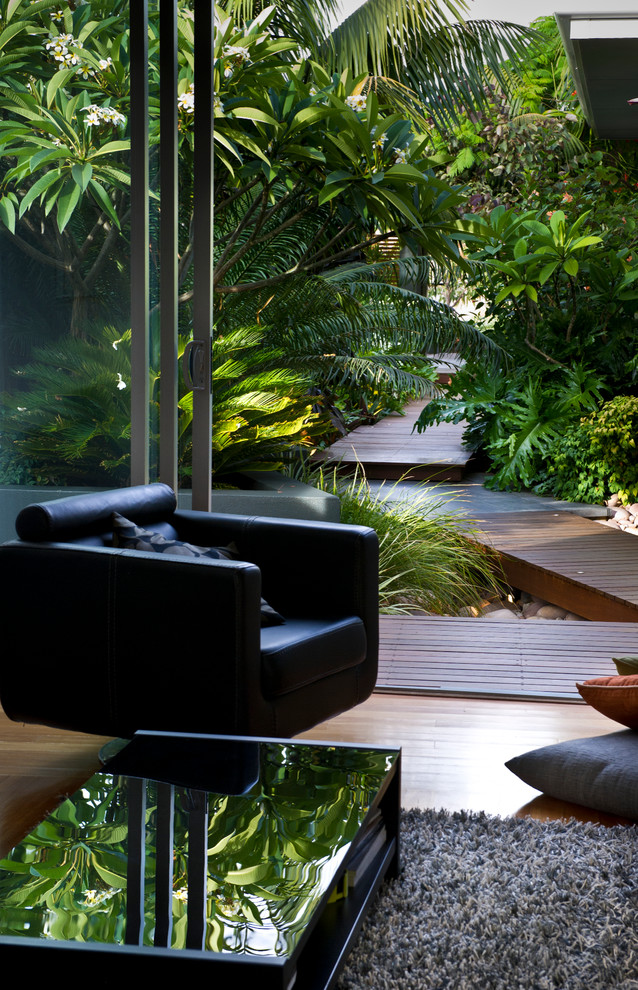 Inspiration for a small contemporary front yard garden in Perth with a water feature and decking.