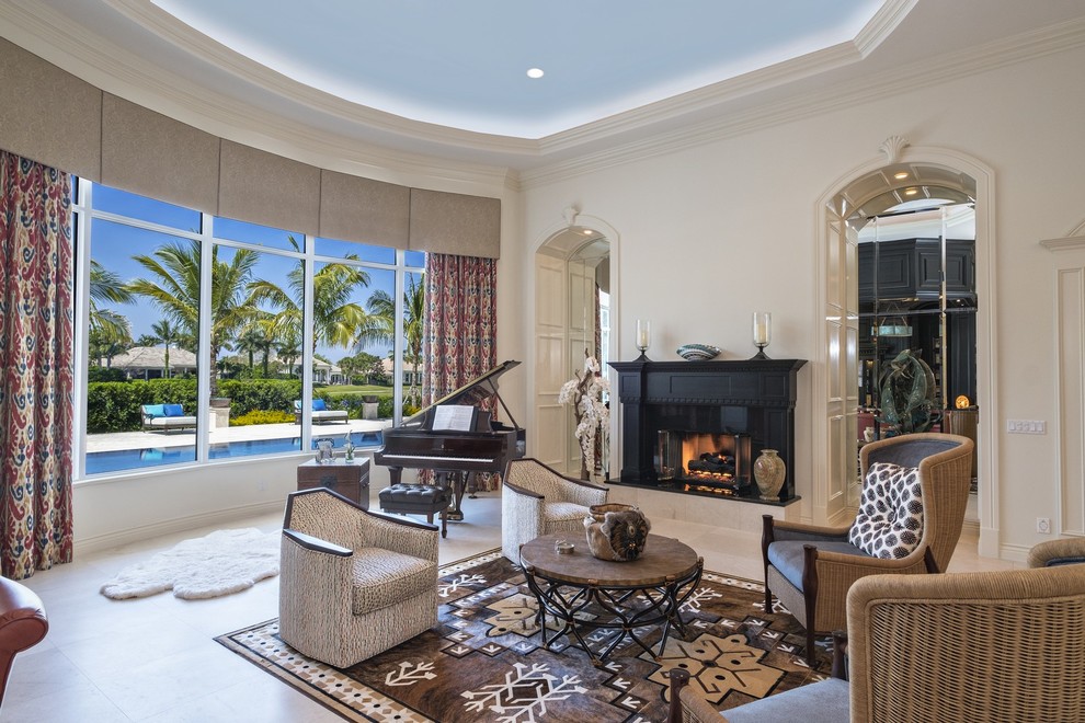 Mediterranean living room in Miami with a music area, beige walls, a standard fireplace, no tv and beige floor.