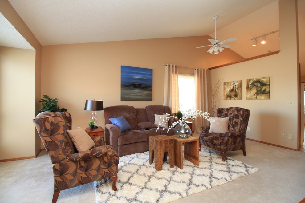 Example of a transitional home design design in Calgary