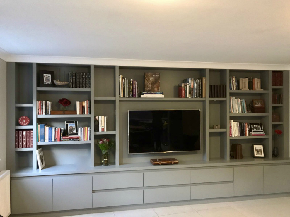 Large contemporary enclosed living room in Surrey with ceramic flooring, a built-in media unit, brown floors, all types of ceiling and all types of wall treatment.