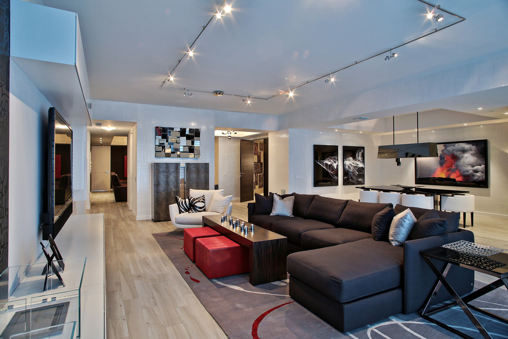 Photo of a large contemporary family room in Miami with white walls, porcelain floors and a wall-mounted tv.