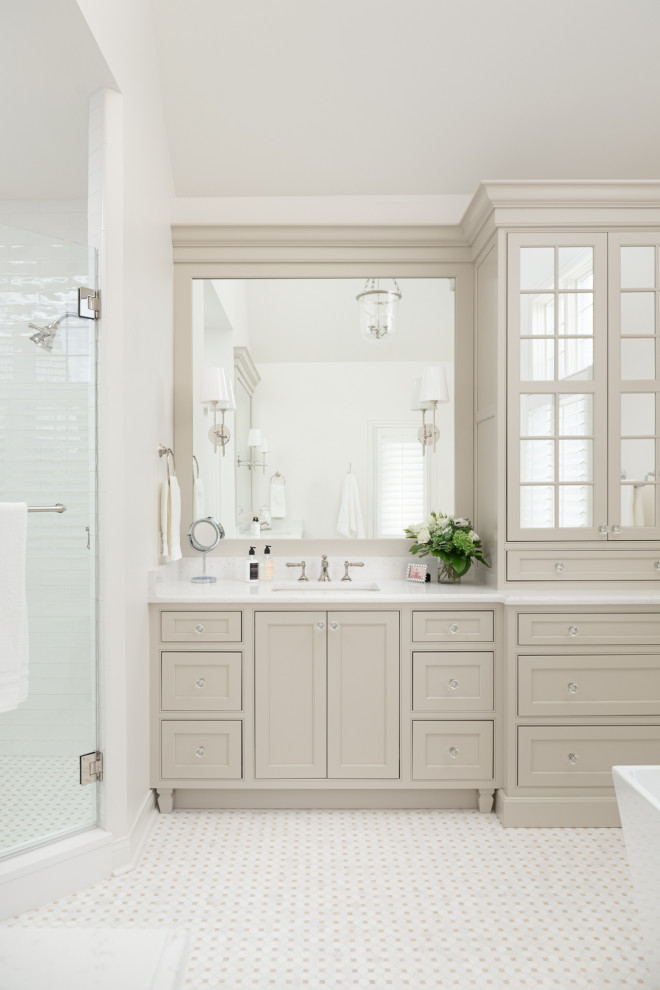 Design ideas for a large traditional master bathroom in Chicago with beaded inset cabinets, beige cabinets, a freestanding tub, a corner shower, white walls, marble floors, an undermount sink, engineered quartz benchtops, beige floor, a hinged shower door, white benchtops, a niche, a double vanity, a built-in vanity and vaulted.