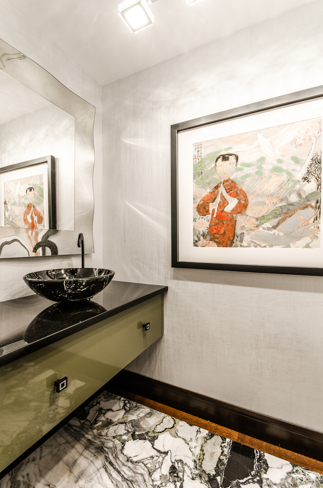Inspiration for a large asian powder room in Montreal with flat-panel cabinets, green cabinets, white walls and a vessel sink.