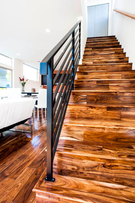 Photo of a mid-sized contemporary wood straight staircase in Seattle.
