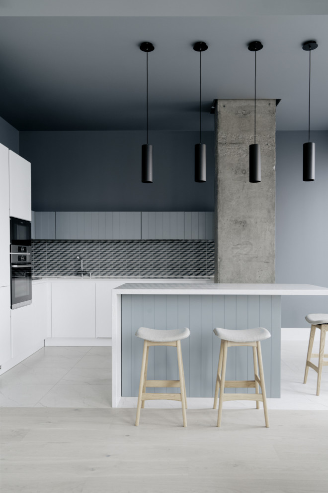 Contemporary l-shaped kitchen in Moscow with flat-panel cabinets, white cabinets, multi-coloured splashback, with island, beige floor, white benchtop and black appliances.