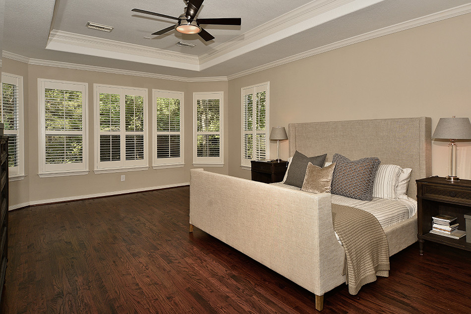 This is an example of a transitional bedroom in Houston.