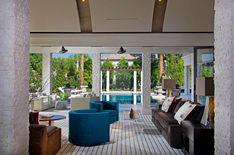Photo of a contemporary patio in Orlando with a roof extension.