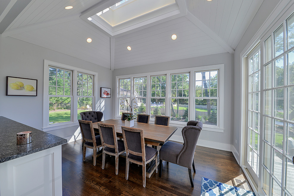 Kitchen - transitional dark wood floor kitchen idea in Chicago with white cabinets and granite countertops