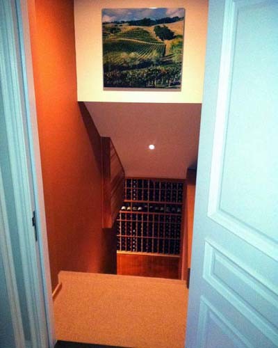 Inspiration for a mid-sized traditional wine cellar in Orange County with storage racks.
