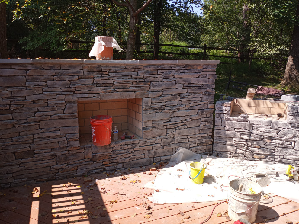 STONE FIREPLACE  , BBQ GRILL   AND STONE RETAINING WALL