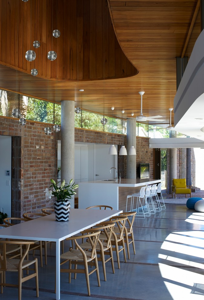 This is an example of a beach style dining room in Wollongong.