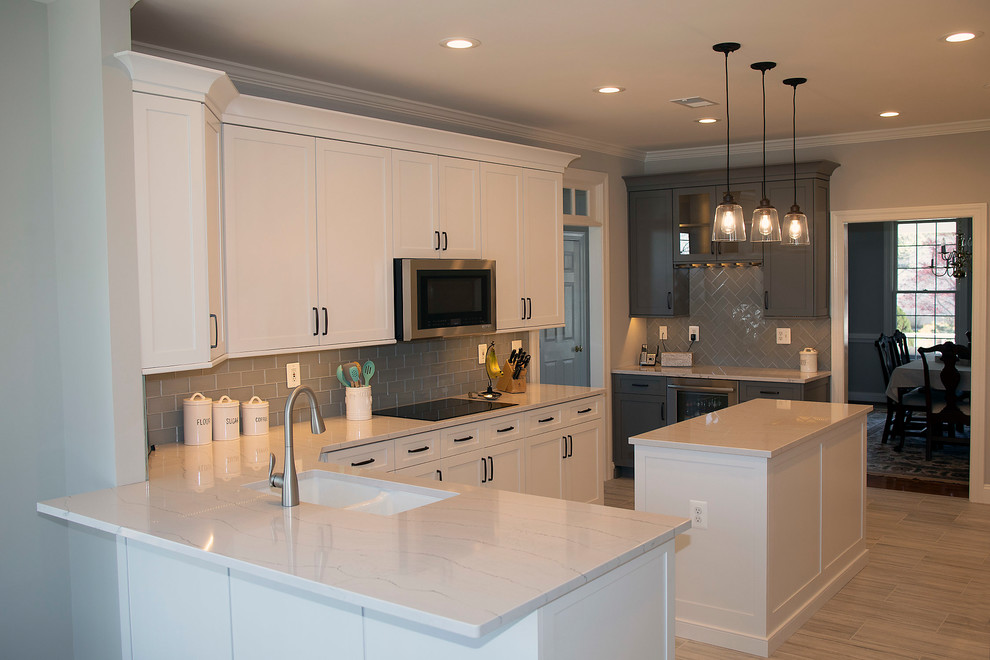 Large transitional u-shaped kitchen photo in DC Metro with shaker cabinets, white cabinets and an island
