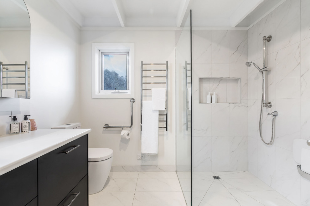 Design ideas for a mid-sized modern bathroom in Melbourne with blue cabinets.