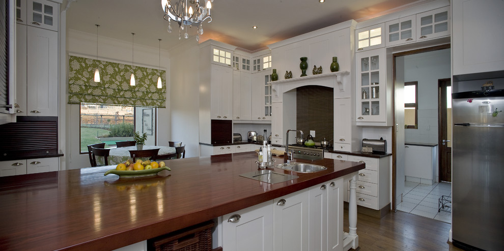 Design ideas for a traditional kitchen in Other with wood benchtops.