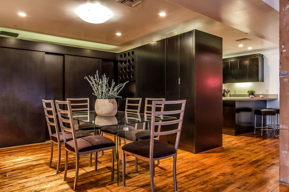Inspiration for a mid-sized industrial dark wood floor kitchen/dining room combo remodel in Los Angeles with no fireplace