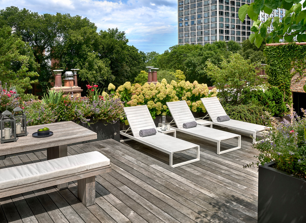 Large contemporary rooftop deck in Chicago with with dock and no cover.