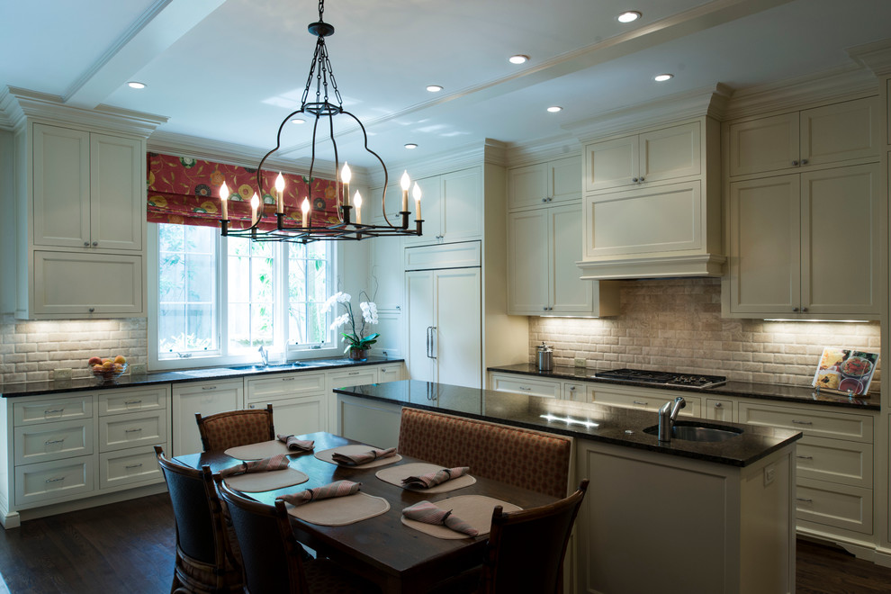 Inspiration for a mid-sized transitional u-shaped dark wood floor kitchen remodel in Atlanta with recessed-panel cabinets, beige cabinets, paneled appliances and an island