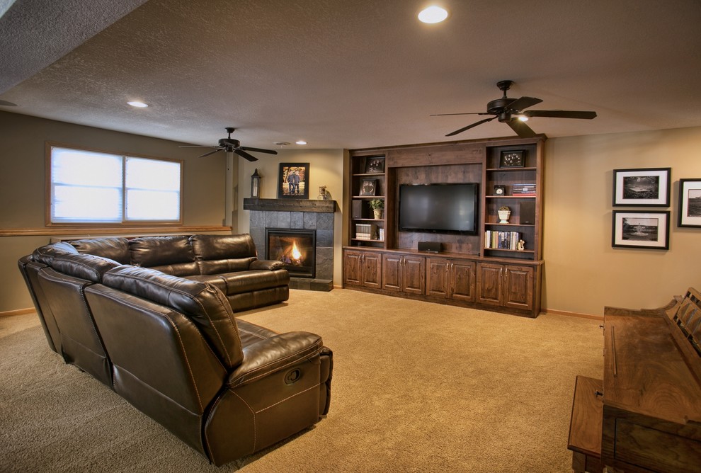 Inspiration for a large transitional enclosed living room in Wichita with beige walls, carpet, a standard fireplace, a stone fireplace surround, a built-in media wall and beige floor.