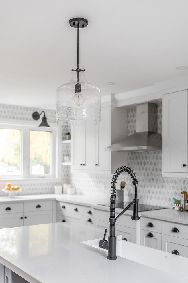 Example of a transitional kitchen design in Toronto