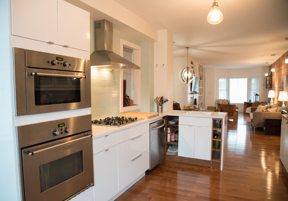 Kitchen - rustic kitchen idea in Toronto with flat-panel cabinets, white cabinets, blue backsplash and stainless steel appliances