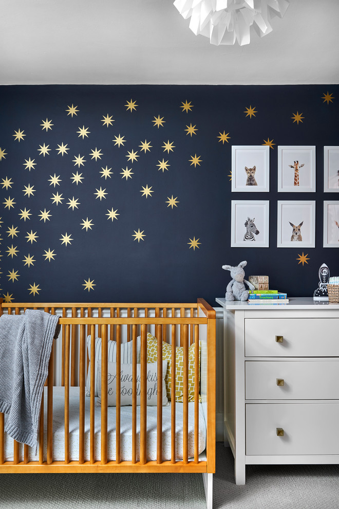Example of a gender-neutral carpeted and beige floor nursery design in Toronto with blue walls